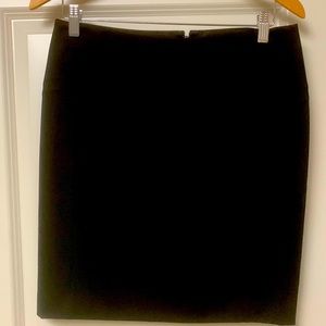 Woman’s black mini skirt